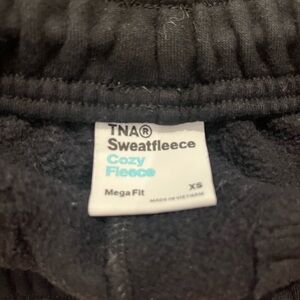 TNA Aritzia black cargo sweatpants